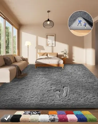 Large plush geometric cream and gray Moroccan area rug framing the lower two-thirds of a stylish platform bed