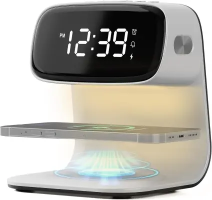 Sleek wooden LED digital alarm clock with wireless charging pad powering a smartphone on a clean contemporary nightstand