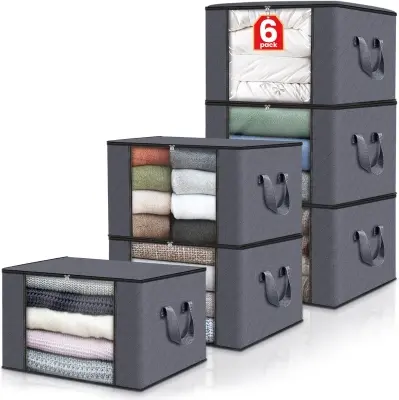 Stack of breathable fabric zippered bedding storage bags with clear vinyl viewing windows organized on a closet shelf