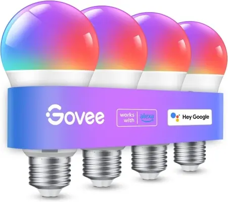 Smart ambient LED light bulb radiating a warm sunset glow inside a modern ceramic bedside lamp in a cozy bedroom