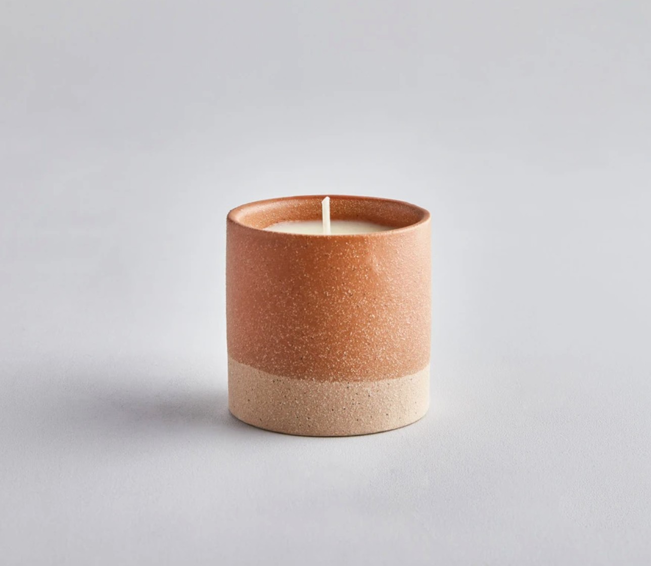 Warm Vanilla Amber Candle in Frosted Jar on Bedroom Nightstand