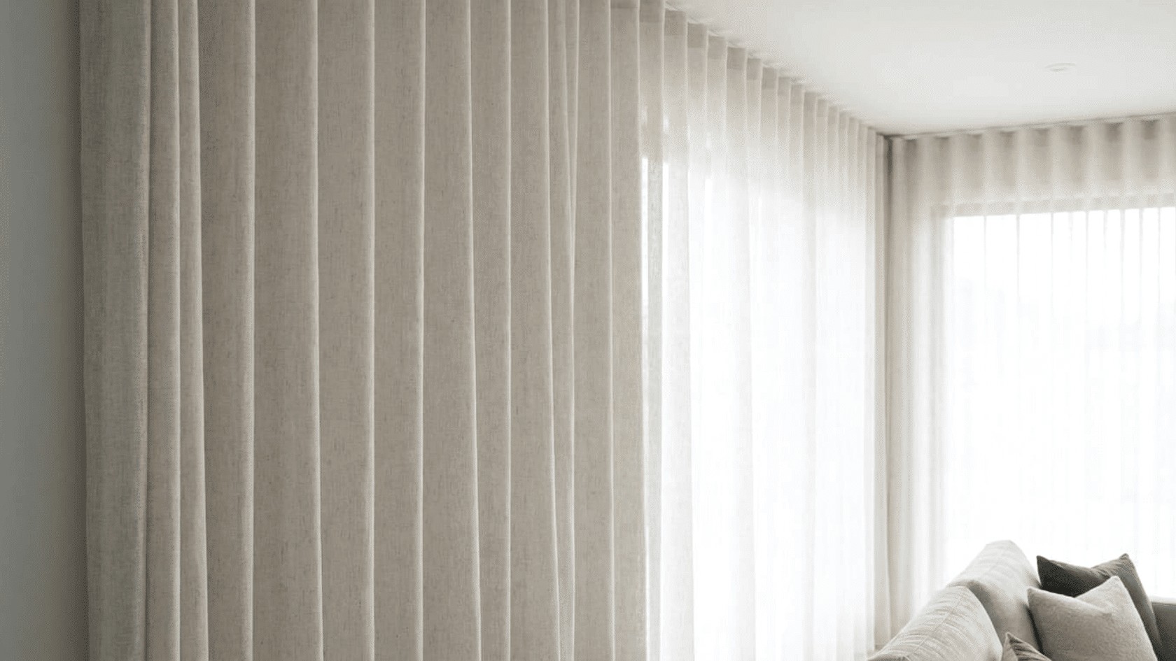 Sleek Ceiling-Track Ripplefold Wave Curtains in Modern Penthouse