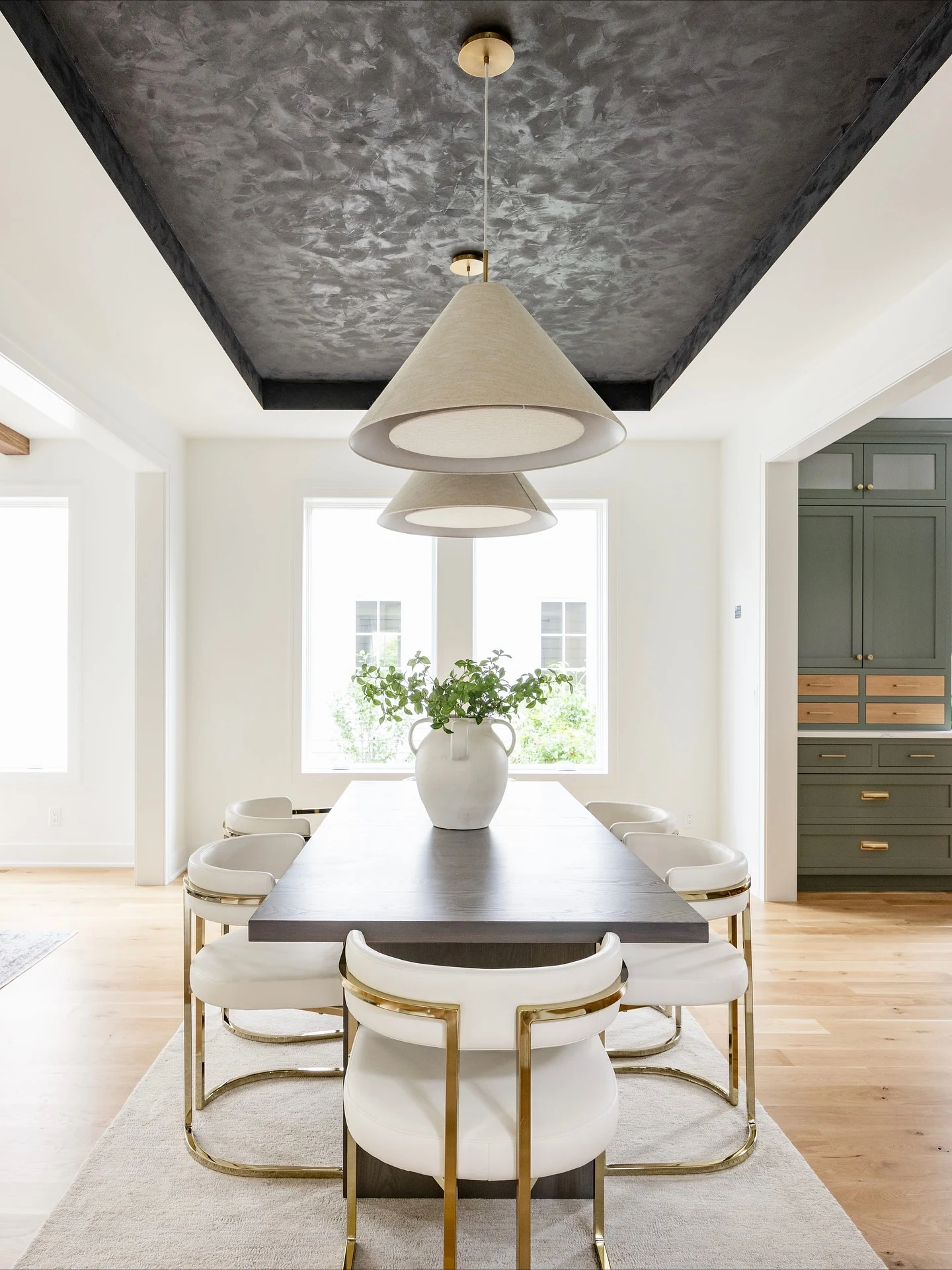 Farmhouse Wood and Metal Lantern Fixture Over a Rustic Dining Table