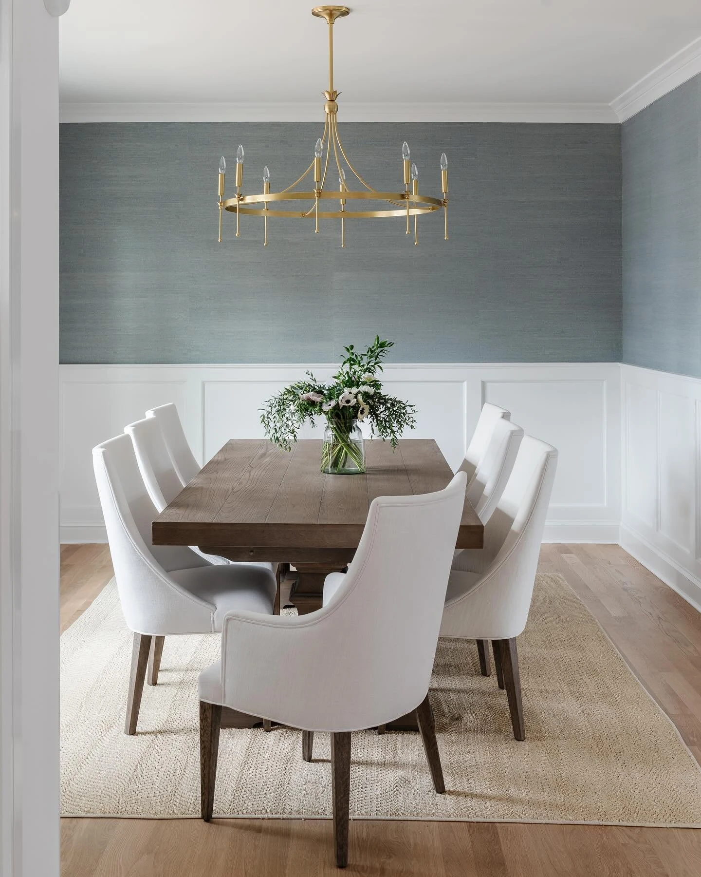 Mid-Range Statement Chandelier Over a Modern Dining Table