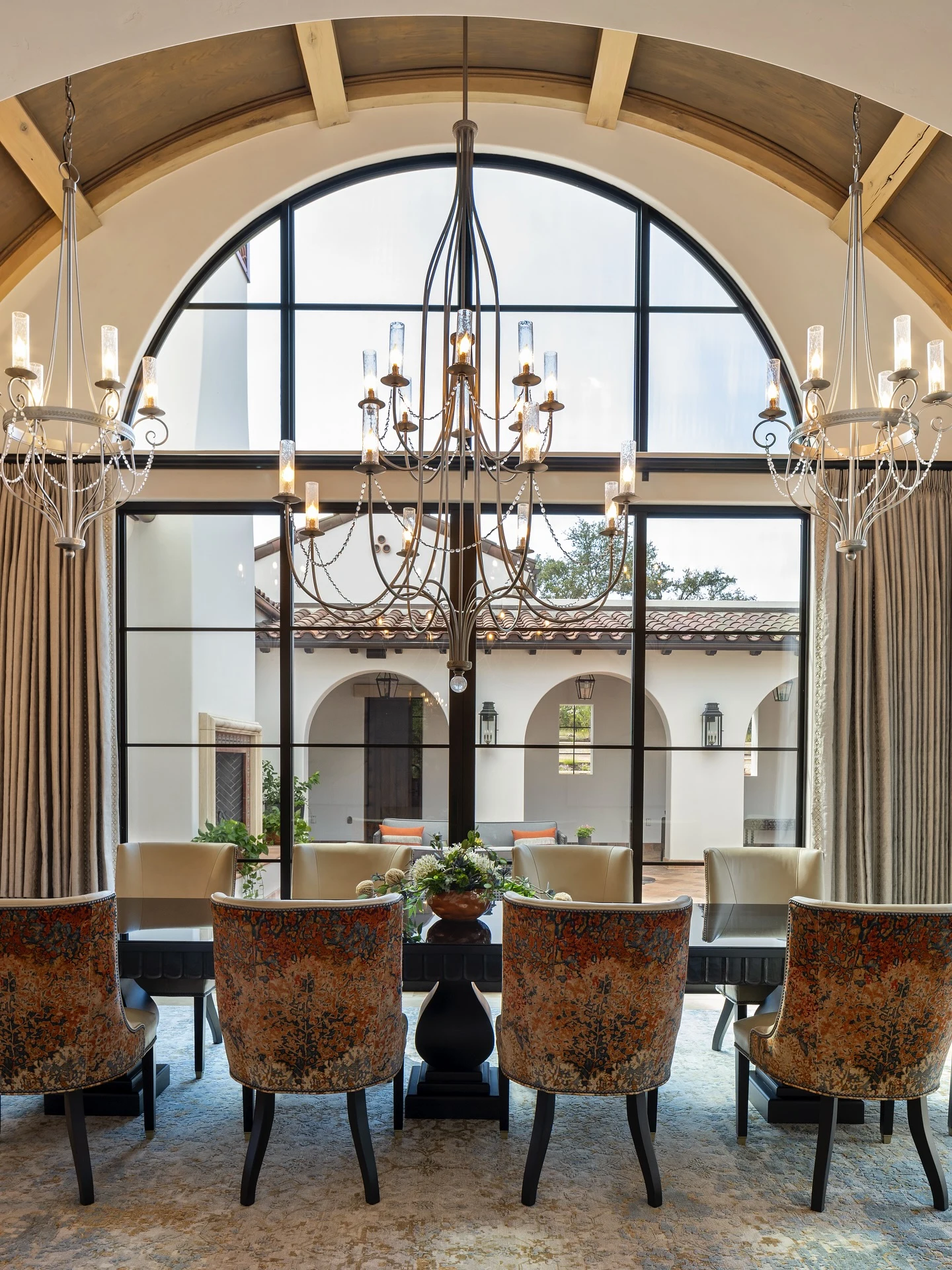 Oversized Luxury Designer Chandelier Over a Formal Dining Table