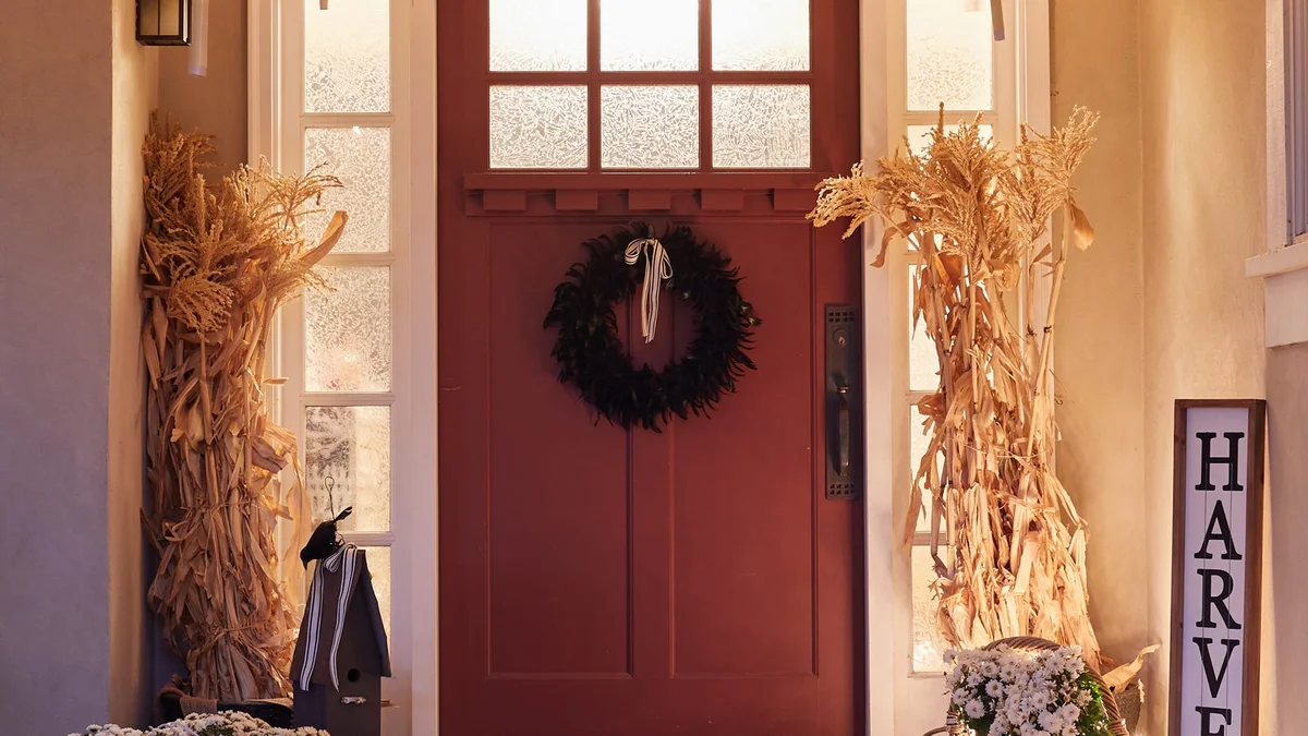 Enchanting front porch with warm floating candle tapers suspended invisibly from the ceiling casting a magical golden glow