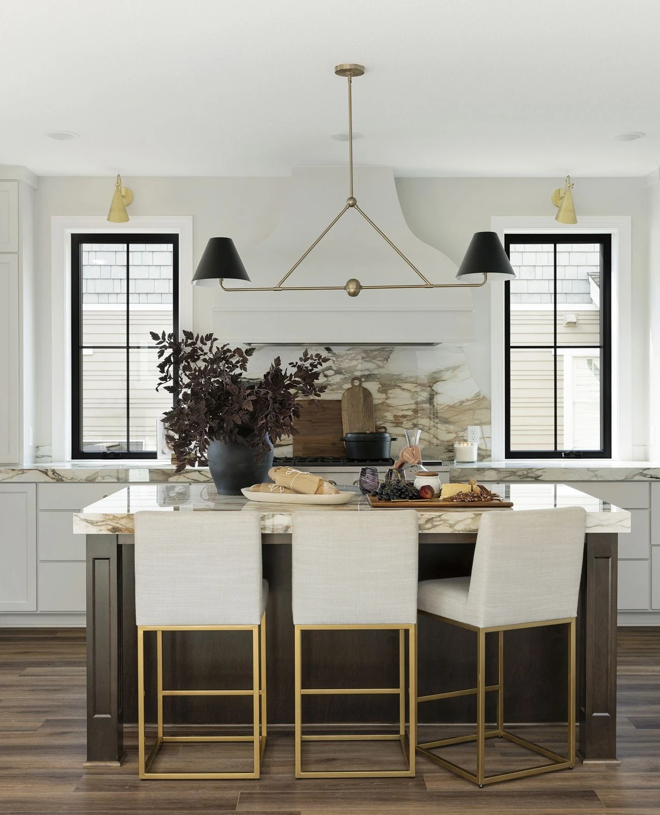 Angular Sculptural Metal Fixture Over a Contemporary Kitchen Island
