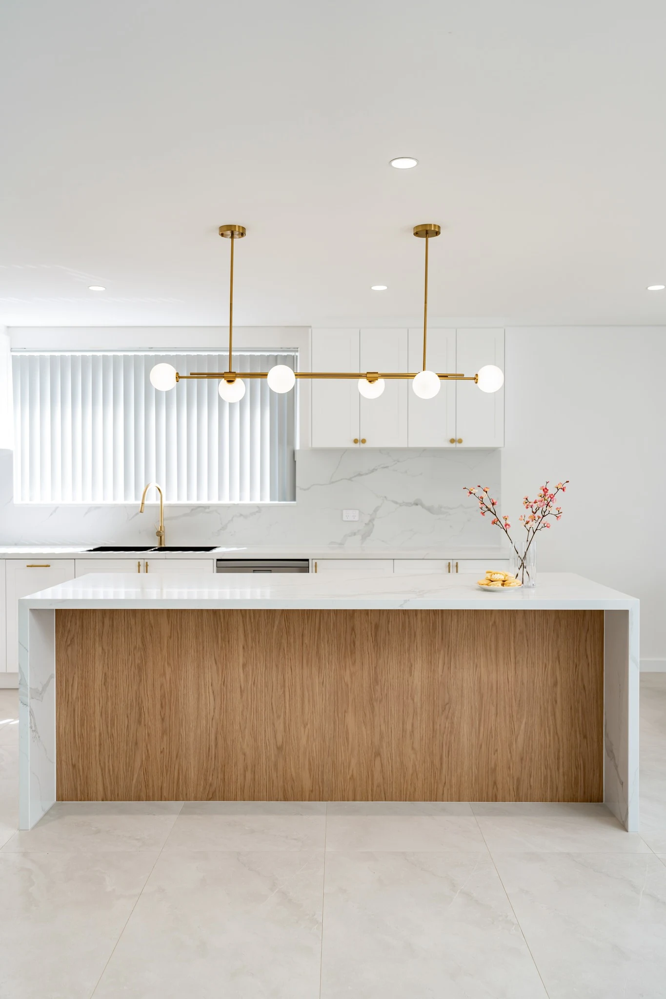 Bold Color-Lacquered Metal Pendant Shades Over a Kitchen Island