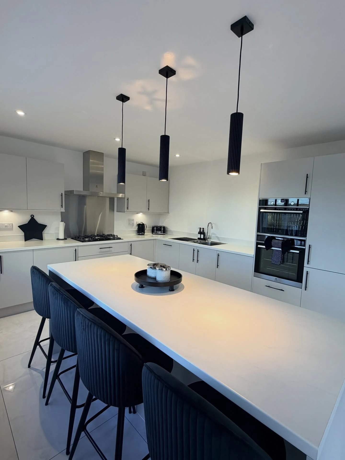Mixed-Height Pendant Cluster Over a Kitchen Island