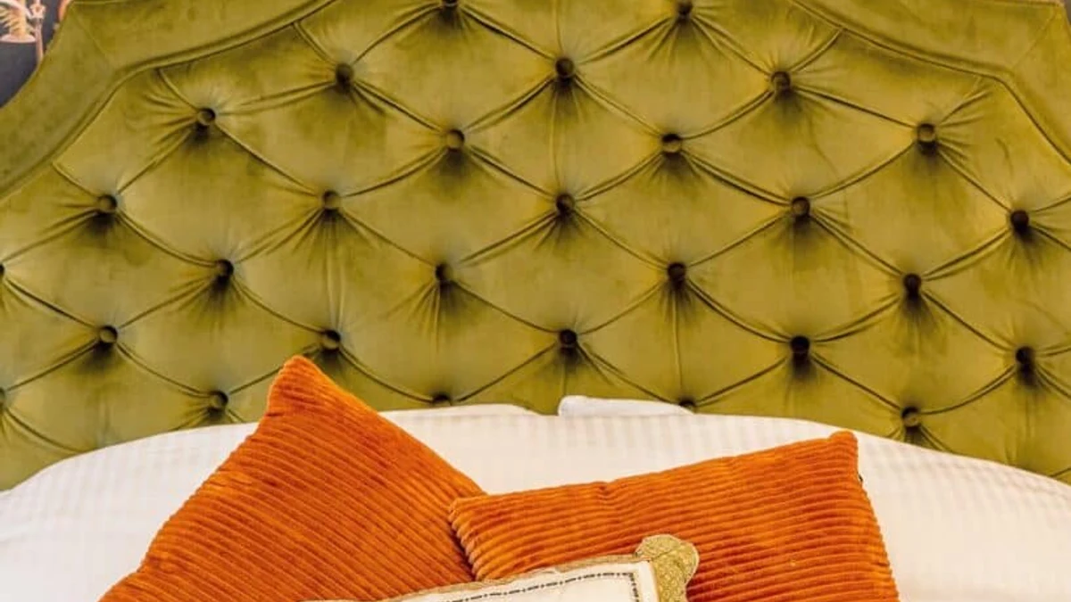 Bold, patterned bedding layered with solid accents