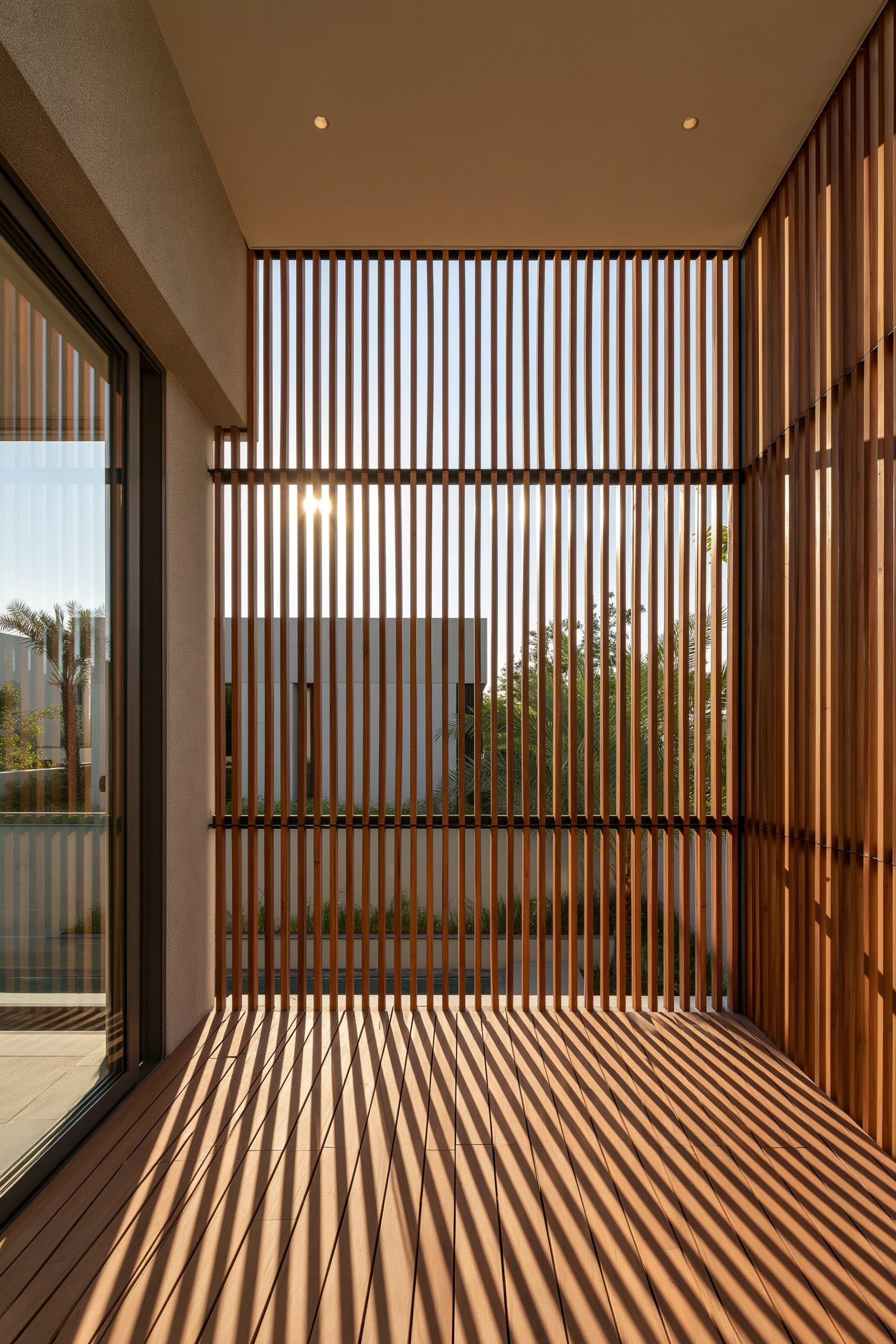 8. A Covered Balcony With a Slatted Wood Screen for Privacy and Shade