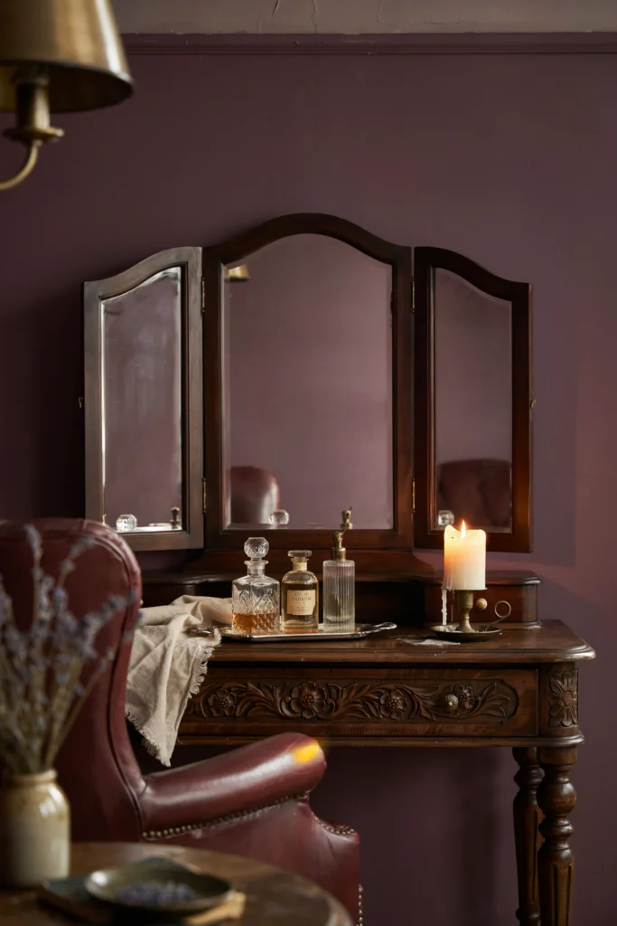 10. Dark, Ornate Wood Furniture with Carved Detailing