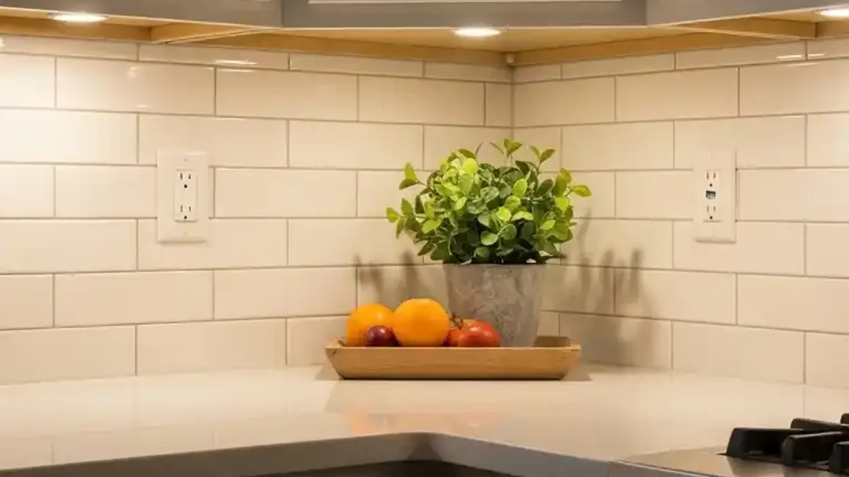 45-degree angled LED aluminum channel illuminating a deep L-shaped kitchen corner countertop evenly